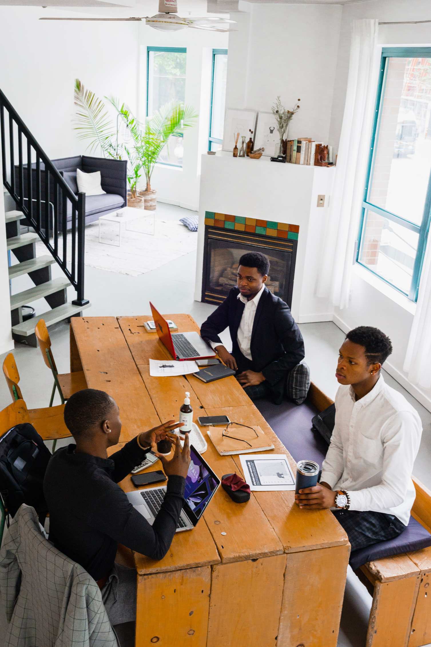 Open office area with colleagues in discussion in a bright office