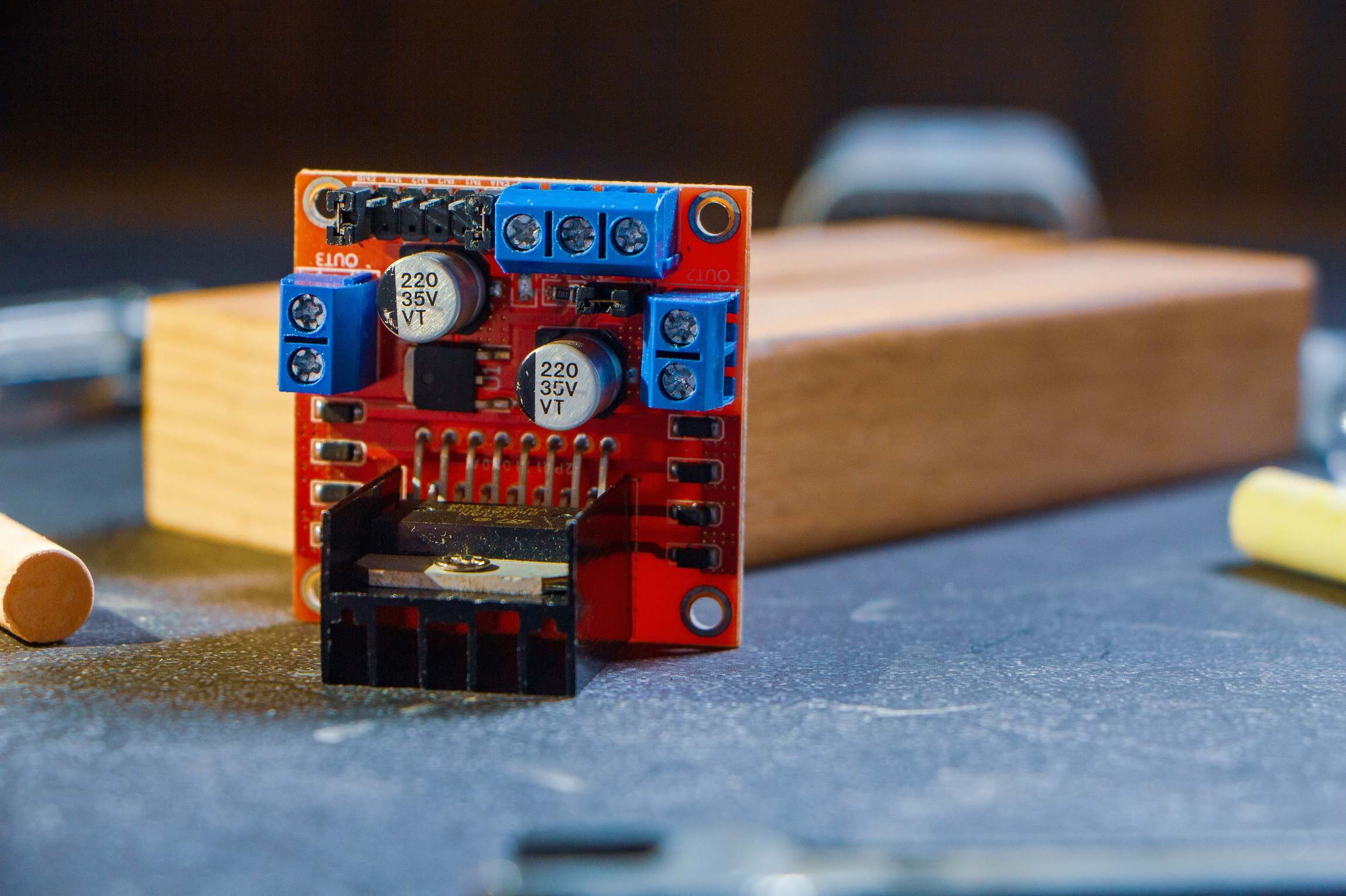 Close view of circuit board and wired connections with capacitors and connectors